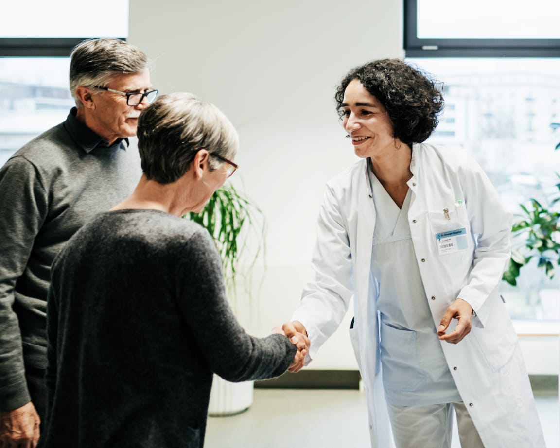 Doctor with husband and wife