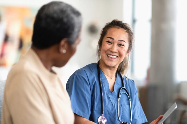 nurse showing woman results